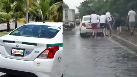 Los turistas fueron captados empujando el taxi que los transportaba, que quedó varado en la Zona Hotelera de Cancún Los turistas fueron captados empujando el taxi que los transportaba, que quedó varado en la Zona Hotelera de Cancún
