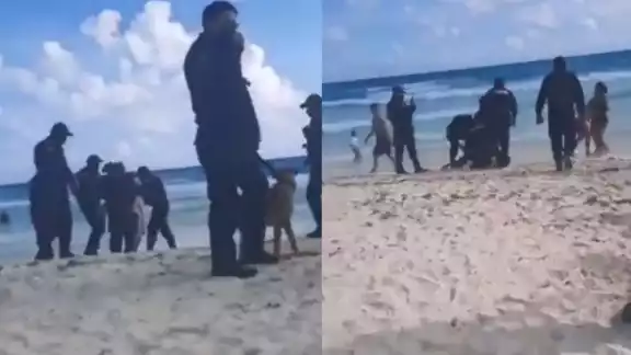 La grabación hecha por un bañista, muestra cómo policías de Cancún someten a un hombre a la orilla de la playa La grabación hecha por un bañista, muestra cómo policías de Cancún someten a un hombre a la orilla de la playa