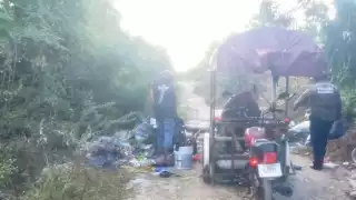 Detienen a dos hombres por tirar basura en la vía pública en Kanasín