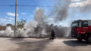 Incendio en basurero clandestino de la Reserva Cuxtal afecta media hectárea de monte
