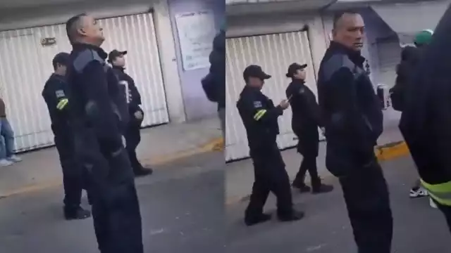 El policía portaba el uniforme mientras perdía el equilibrio