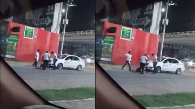 Los taxistas fueron captados mientras agarraban a patadas al hombre que ya se encontraba en el piso