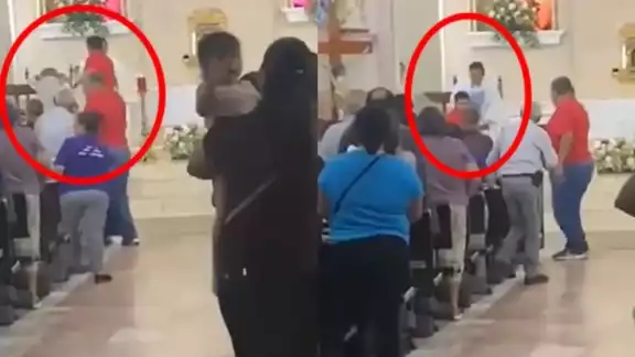 Padre saca a empujones a hombre de la iglesia