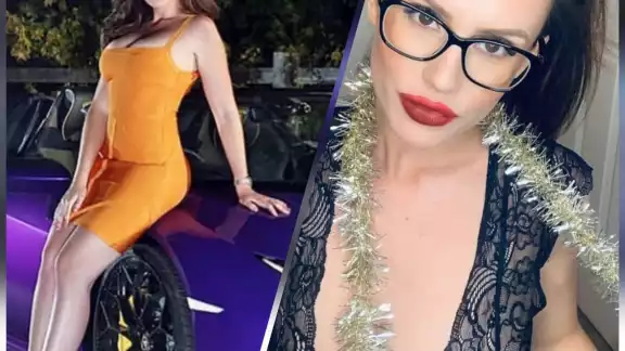 La modelo posa en un lujoso auto de su propiedad La modelo posa en un lujoso auto de su propiedad