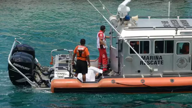 La información preliminar refiere que el cuerpo presentaba las extremidades moradas