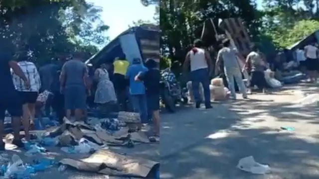 El tráiler quedó sobre la carretera, mientras un grupo de personas se apoderaba de la mercancía