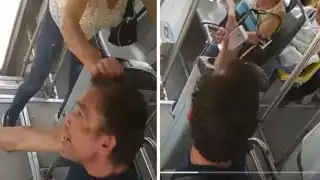 Mujer jala de los pelos a chofer de camión por no bajarla donde quería: VIDEO