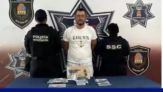Conductor en Cancún es detenido con droga y arma de fuego