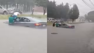 Automovilista queda atrapado en calle inundada en Puebla.