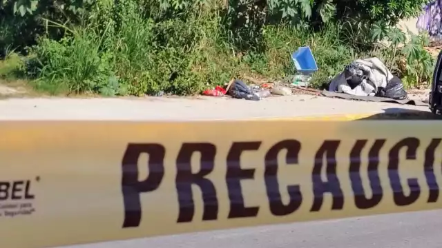 Encuentran cuerpo embolsado sobre la avenida Chetumal en la región 245 de Cancún