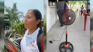 Joven lleva su ventilador a la escuela