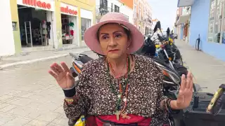 Clamor de justicia: Doña Luz Domínguez, artista urbana, denuncia agresión de un banco de Campeche