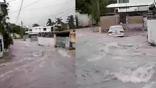 Un automóvil fue arrastrado por la corriente en el barrio Santa Lucía tras intensa lluvia.