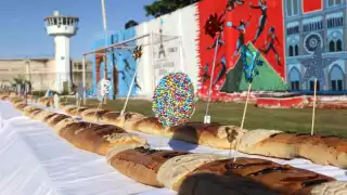 Personas privadas de la libertad del Cereso de Mérida parten gran Rosca de Reyes de 400 metros