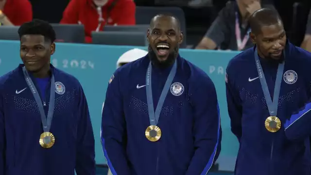 El team USA con su medalla de oro