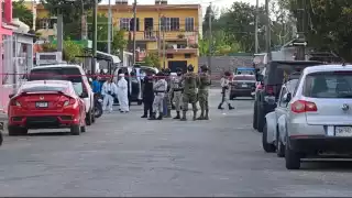 Ejecutan a dos hombres en Cozumel, menor resulta herido por bala