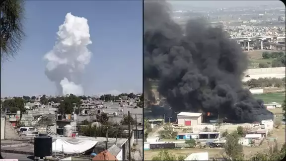 Una larga columna de humo se formó tras la explosión de los polvorines. Una larga columna de humo se formó tras la explosión de los polvorines.