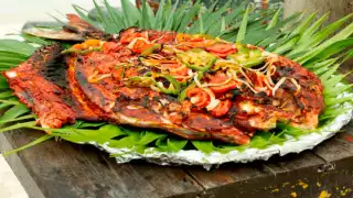 Descubre el sabor del Tikinxic: El platillo emblemático de Cancún