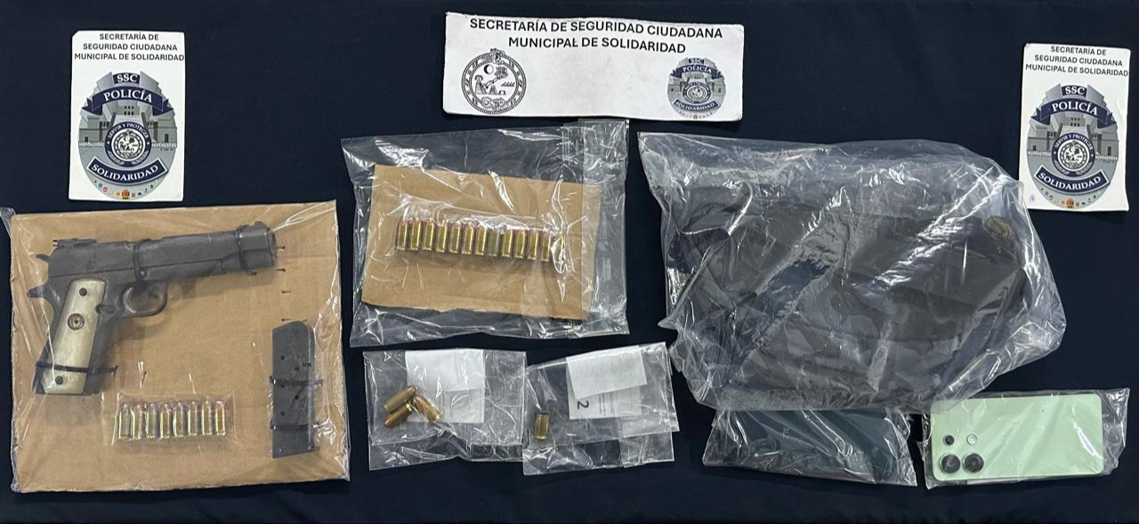 En la detención se confiscaron balas, arma de fuego y un celular En la detención se confiscaron balas, arma de fuego y un celular