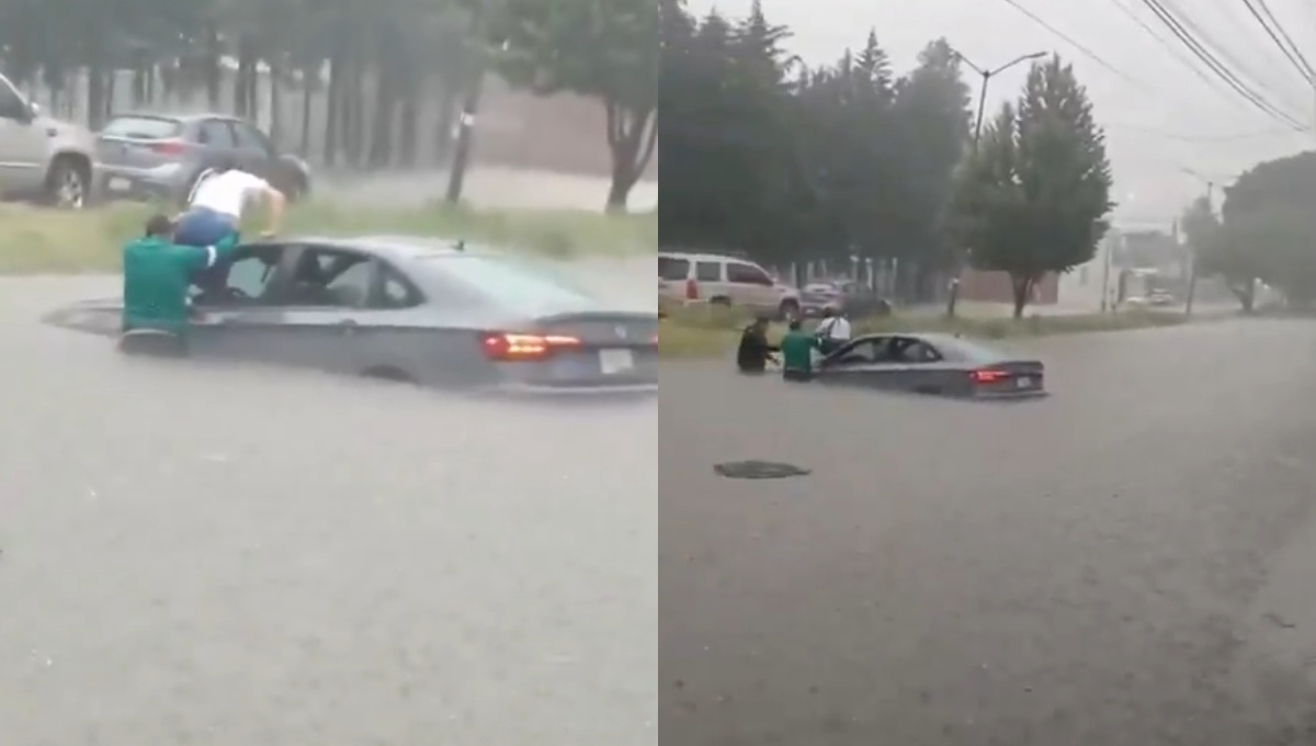 Automovilista queda atrapado en calle inundada en Puebla.