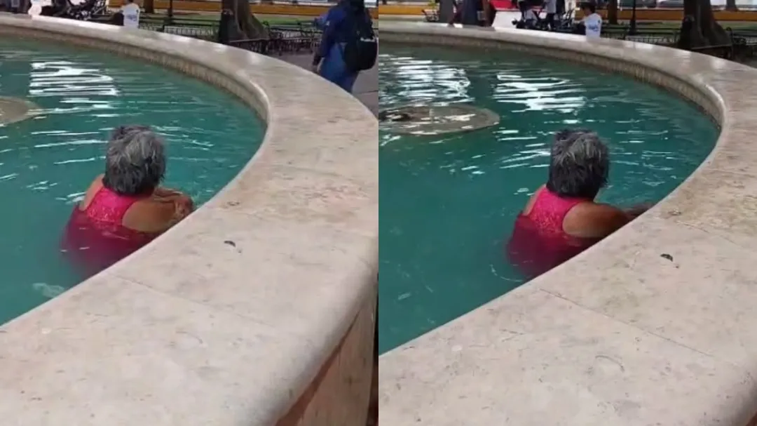 En pleno calor de hasta 47 grados, mujer disfruta de la fuente del parque de San Juan en Mérida: VIDEO