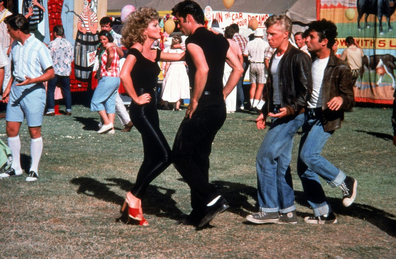 John Travolta y Olivia Newton-John fueron los protagonistas de Grease, dando vida a Sandy Olsson y a Danny Zuko John Travolta y Olivia Newton-John fueron los protagonistas de Grease, dando vida a Sandy Olsson y a Danny Zuko