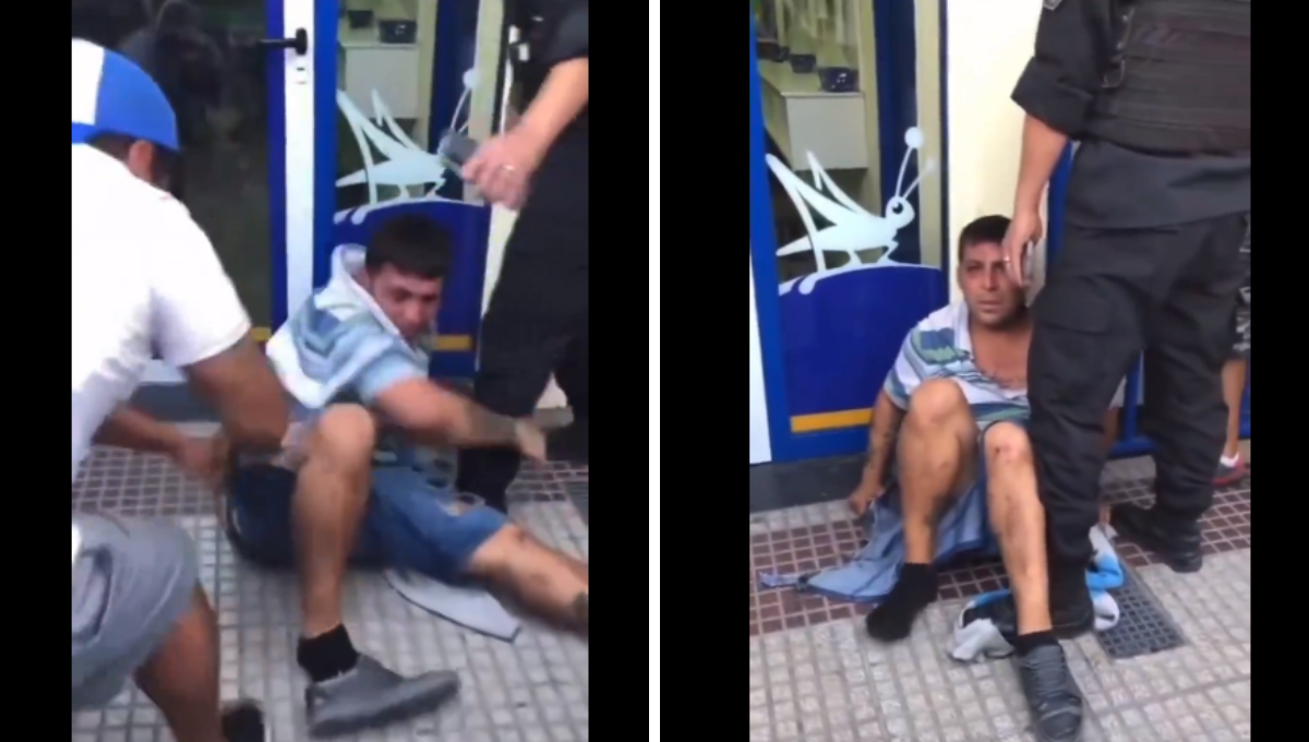 El hombre se abrazaban de la pierna de un policía
