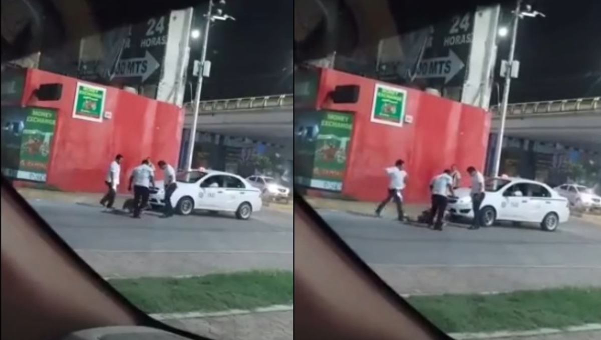 Los taxistas fueron captados mientras agarraban a patadas al hombre que ya se encontraba en el piso